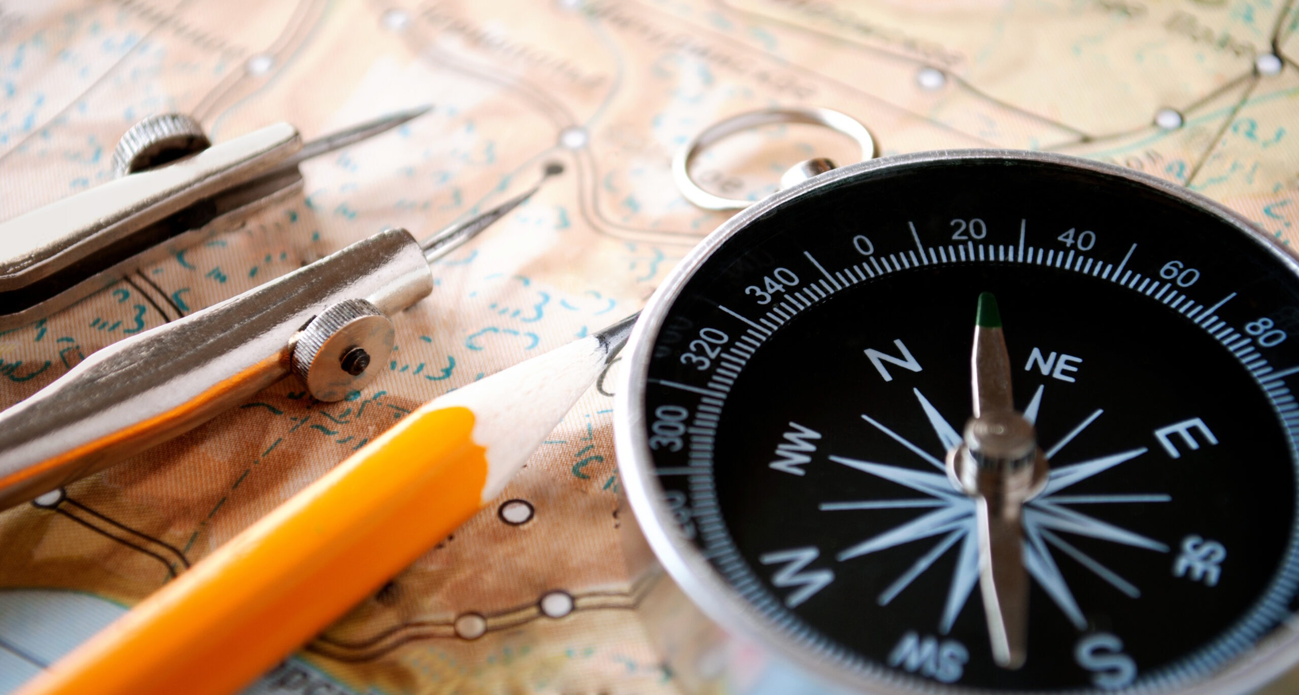 Conceptual Image of a Magnetic Compass and Pencil