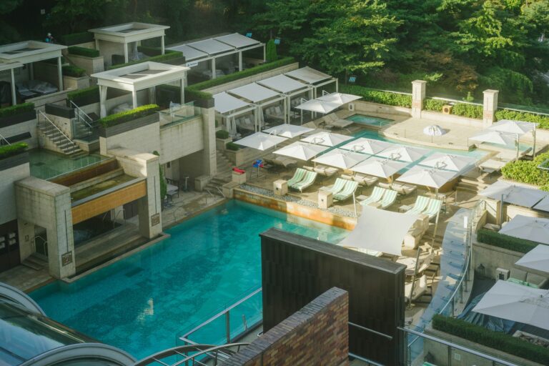 Luxury Resort Swimming Pool Surrounded by Private Cabanas